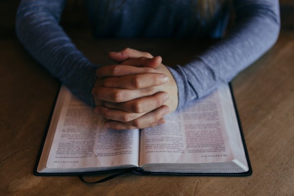 Hands over bible pic 2 Hands over bible pic 2